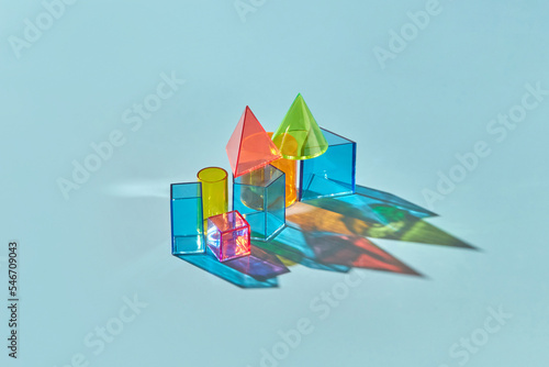 Various multicolored geometric glass shapes. photo