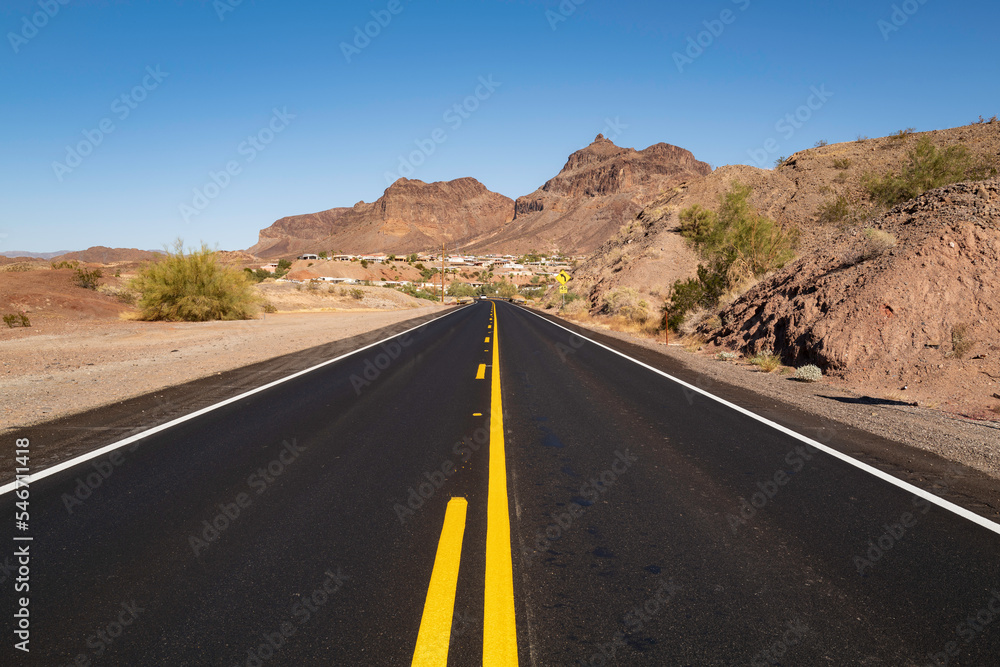 Road to the arid desert mountains in the Havasu City area along the Colorado River, Arizona, USA Road to the arid desert mountains in the Havasu City area along the Colorado River, Arizona, USA