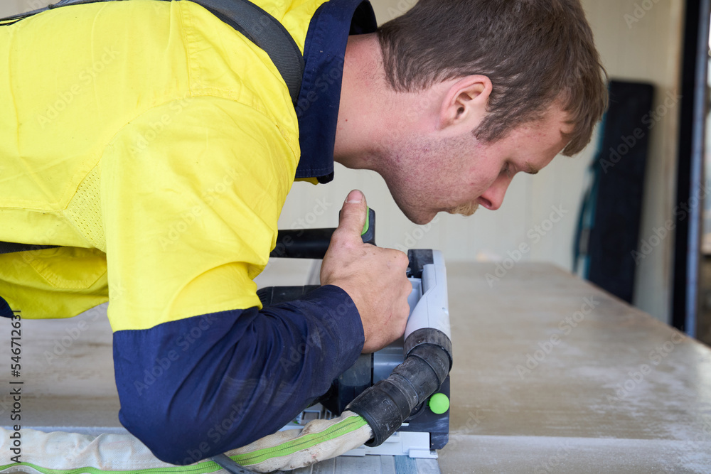 © Rowena Naylor/Stocksy - Tradesman using planer tool © Rowena Naylor/Stocksy - Tradesman using planer tool