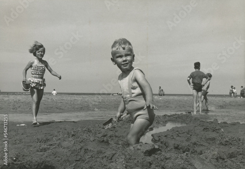 boy playing at beach photo