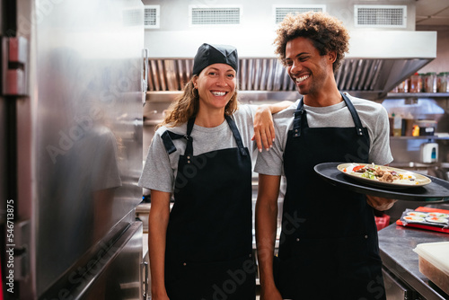 Multiracial colleagues working in restaurant photo