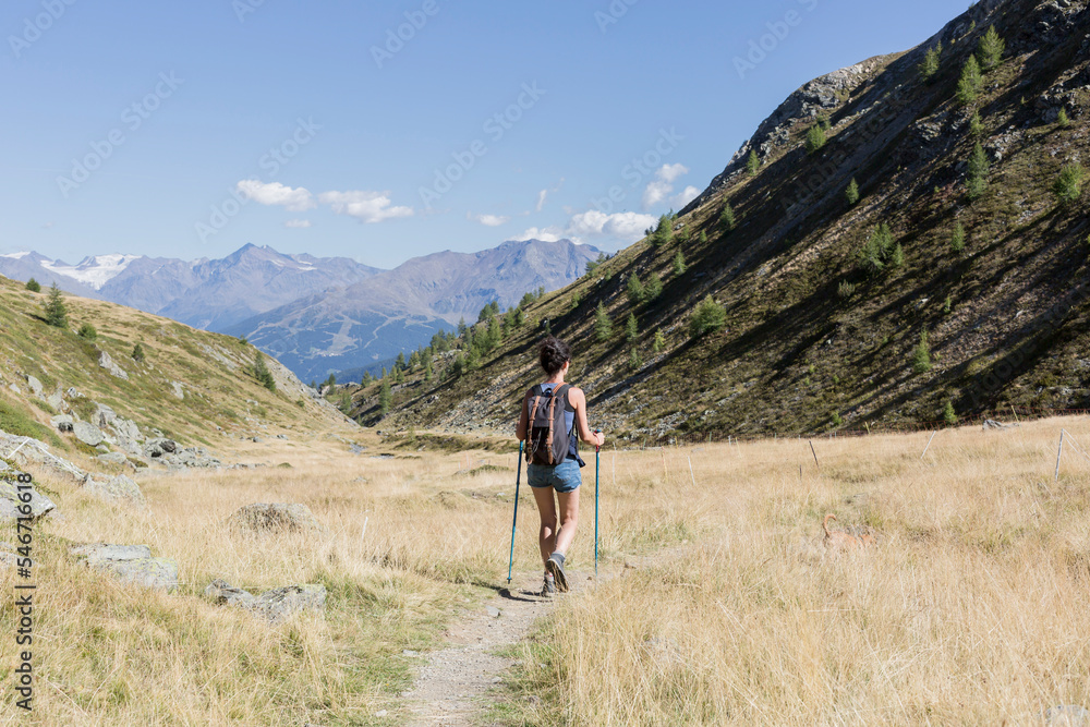 hiker girl walks in mountainous landscape hiker girl walks in mountainous landscape