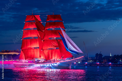 A ship with scarlet sails. Floats along the Neva River in the city of St. Petersburg. A celebration dedicated to school graduates.