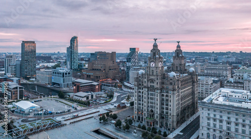 Aerial view with Royal Liver Building in Liverpool docklands in the city center, first rays at sunrise