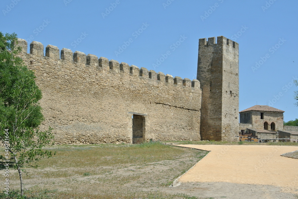 Ruins of the medieval castle wall in Europe in good weather 