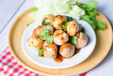 Meatballs on plate with with spicy sauce, Grilled meatball and pork ball, Meat ball on skewers and fresh coriander vegetables cabbage, Thai food Asian food Meat balls - pork balls