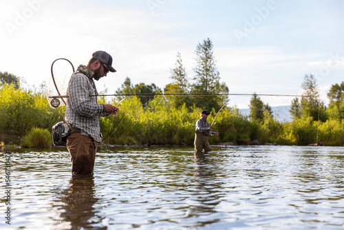 Fly Fishing Portrait of two men Provo River Utah in United States  photo
