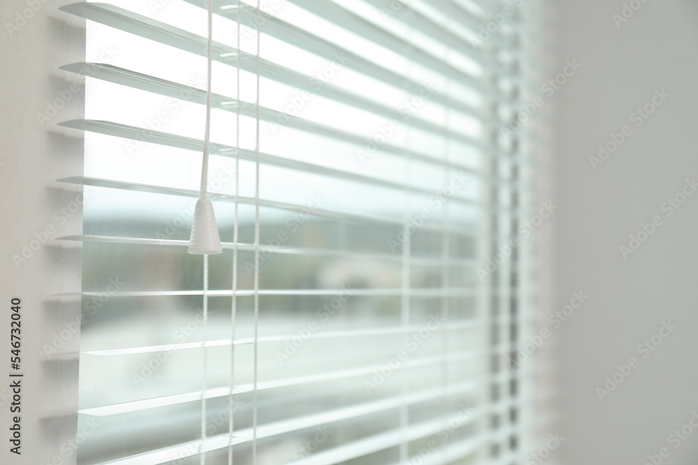 Closeup view of stylish horizontal window blinds Closeup view of stylish horizontal window blinds