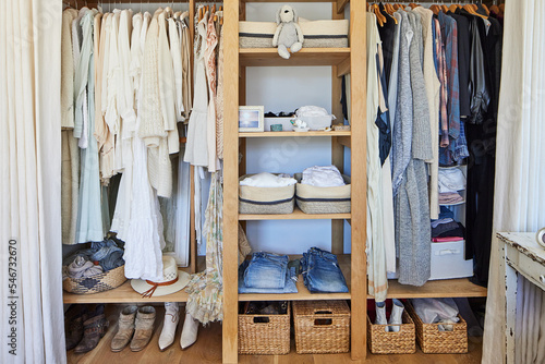 Organized closet with clothes photo