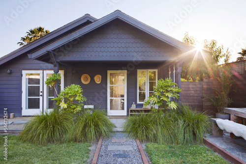 Front exterior of farmhouse cottage and yard