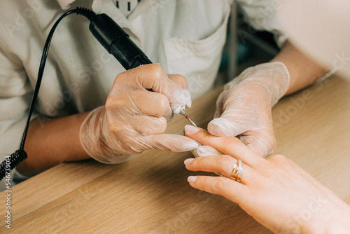 Close up of a hand receiving manicure photo