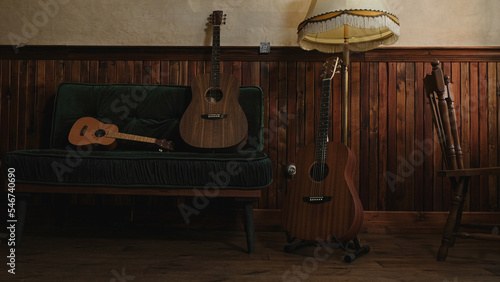 Guitars and ukulele in vintage interior. 
 photo