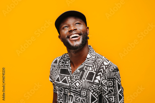 Cheerful black man looking away photo