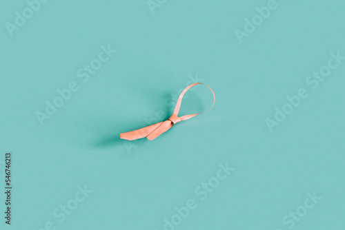 pink tie on a blue background photo