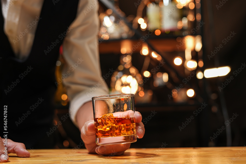 Bartender pouring Whiskey, on  bar,
