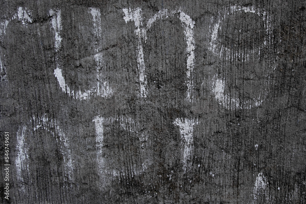 Obraz premium Old concrete wall with white painted letters urban grunge texture