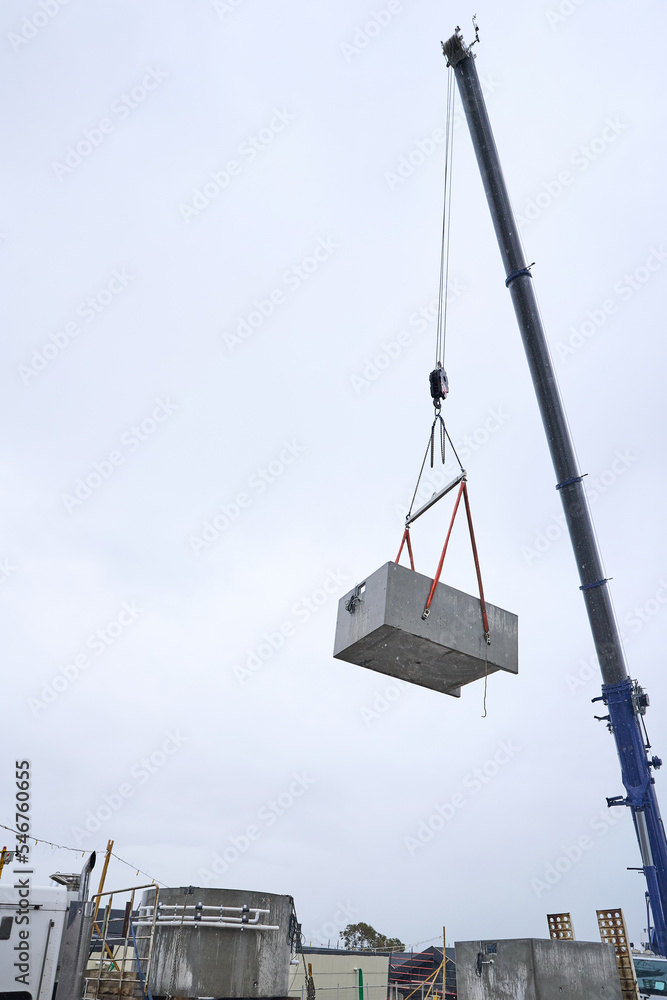 Concrete spa pool being lifted by large crane Concrete spa pool being lifted by large crane