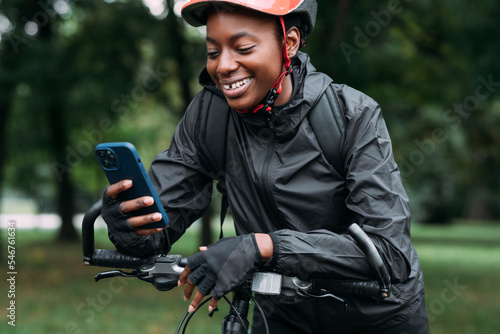Cyclist Woman Using Mobile Phone photo