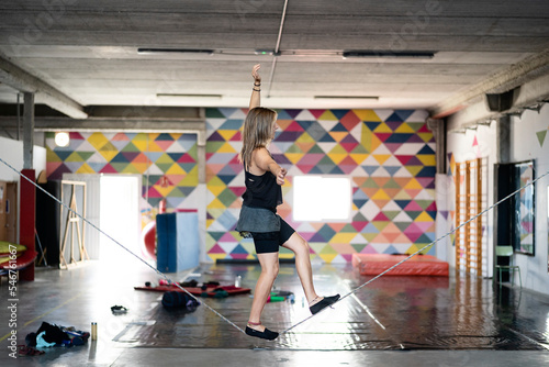 woman balancing on a tightrope