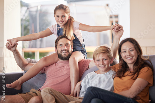 Family, love and relax on a sofa by children with parents in living room, happy and smile while bonding in their home. Portrait, happy family and kids with mom and dad in lounge, cheerful and playful
