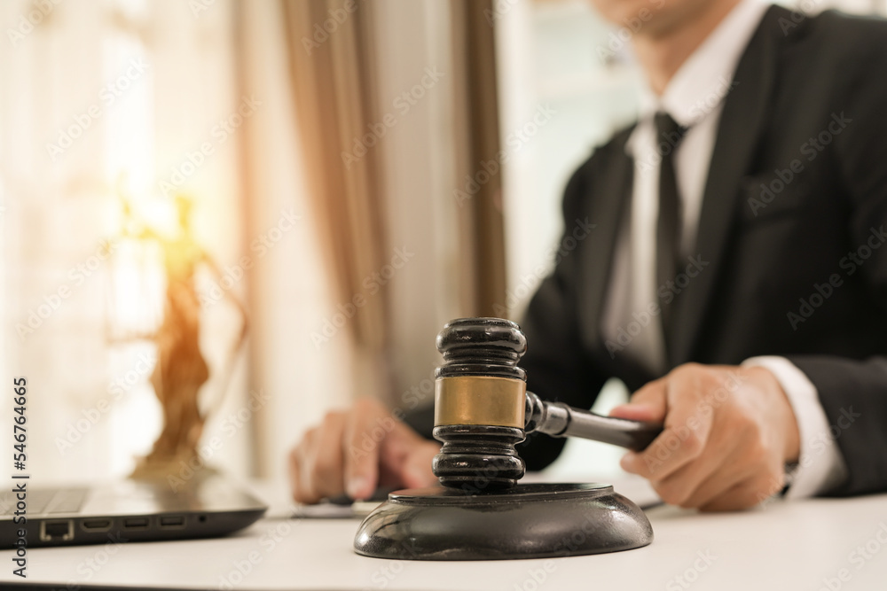 judge on wooden table And experienced lawyers meet with clients and give advice behind the scenes. legal services legal consulting concept judge on wooden table And experienced lawyers meet with clients and give advice behind the scenes. legal services legal consulting concept