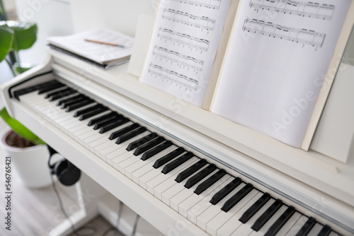 Digital Piano And Music Score On It