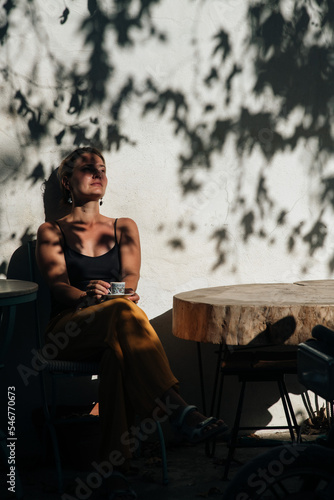 Turkey vibe, woman drinking coffee in the street cafe photo