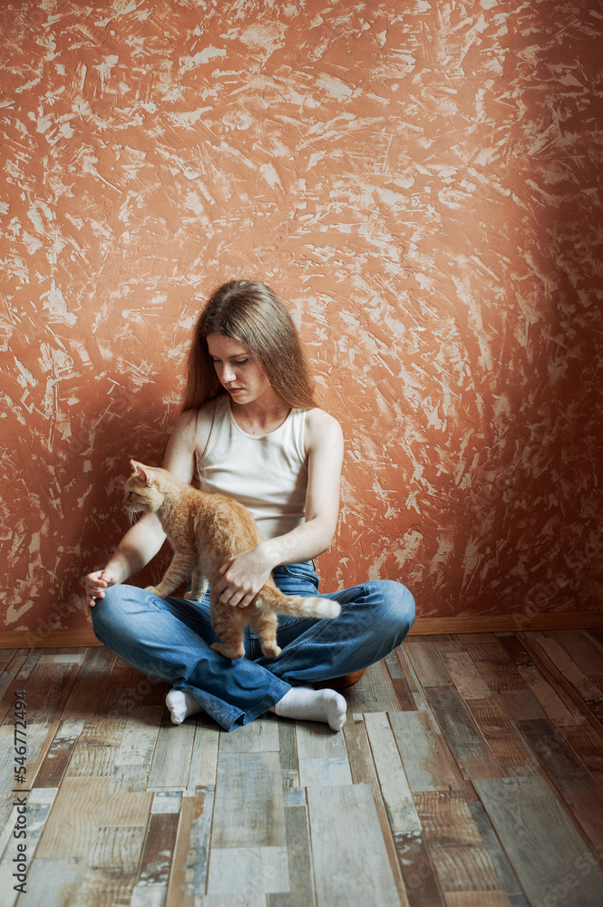 Young blonde woman and her cat Young blonde woman and her cat