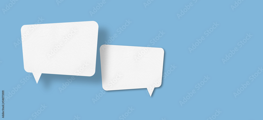 white paper with speech bubbles isolated on blue background communication bubbles white paper with speech bubbles isolated on blue background communication bubbles