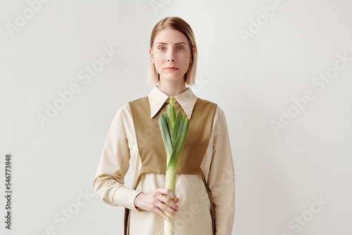 Caucasian Woman Holding Fresh Leek photo