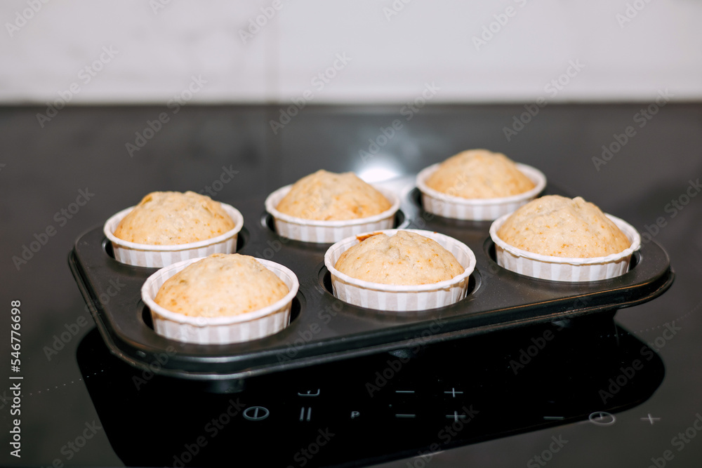 Freshly baked cupcakes in a metal mold Freshly baked cupcakes in a metal mold