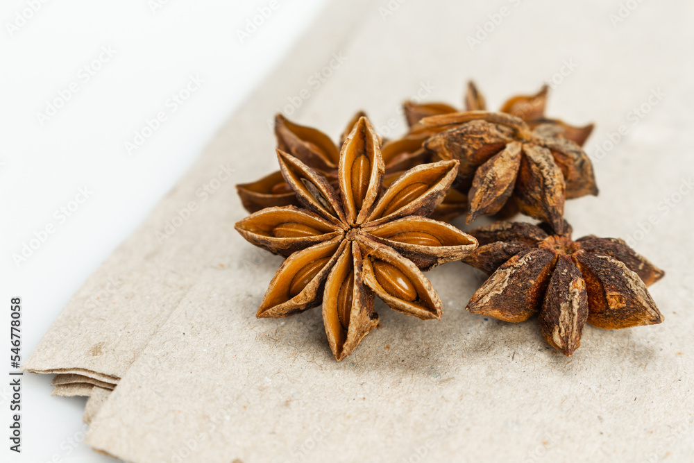 star anise on brown paper background front view close up. star anise on brown paper background front view close up.