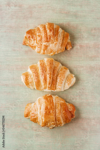 Three croissants on a table photo