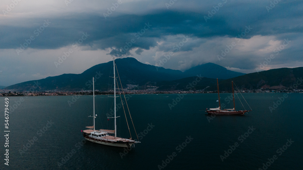 two yachts in marina at a stormy weather two yachts in marina at a stormy weather