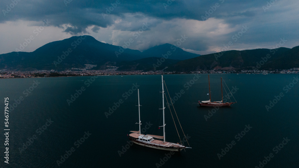 two sailboats in marina at a stormy weather two sailboats in marina at a stormy weather