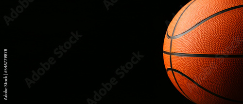 Ball for playing basketball on dark background with space for text, closeup © Pixel-Shot