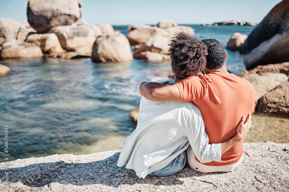 Fototapeta premium Couple, love and hug on beach for relax travel vacation together or bonding on ocean sand with summer sunshine. African man, woman and calm holiday or loving romance date by the sea water outdoors