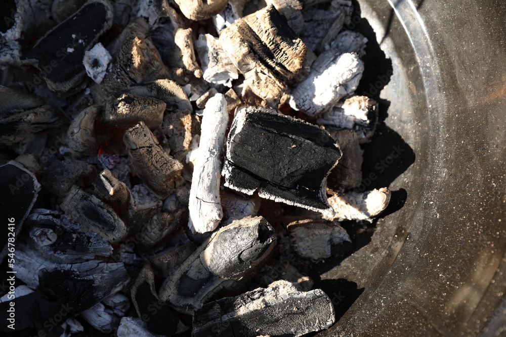 Fototapeta premium Barbecue grill with coals outdoors, top view