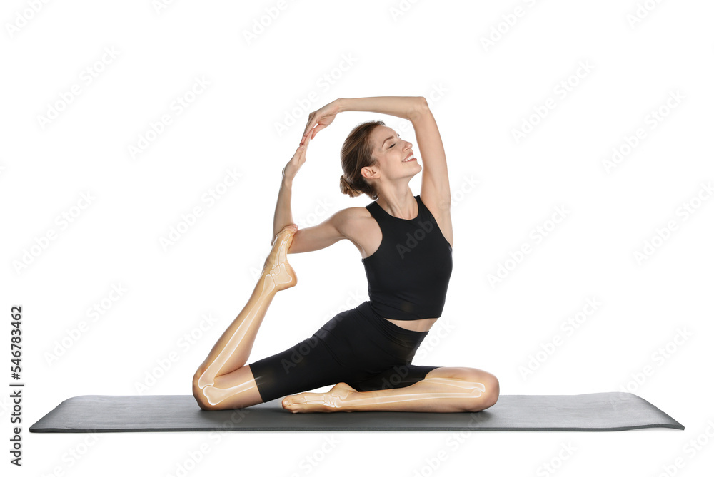 Digital composite of highlighted bones and young woman practicing yoga on white background Digital composite of highlighted bones and young woman practicing yoga on white background