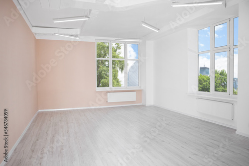 New empty room with clean windows and light walls