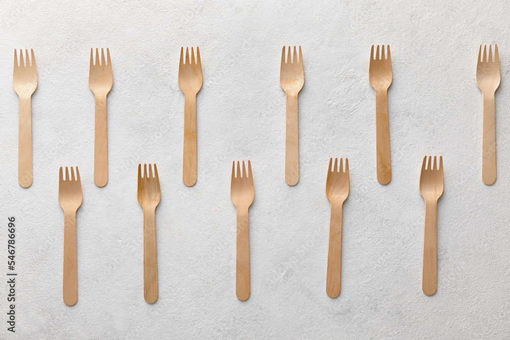 Many wooden forks on white background Many wooden forks on white background