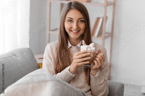 Smiling young woman enjoyin...