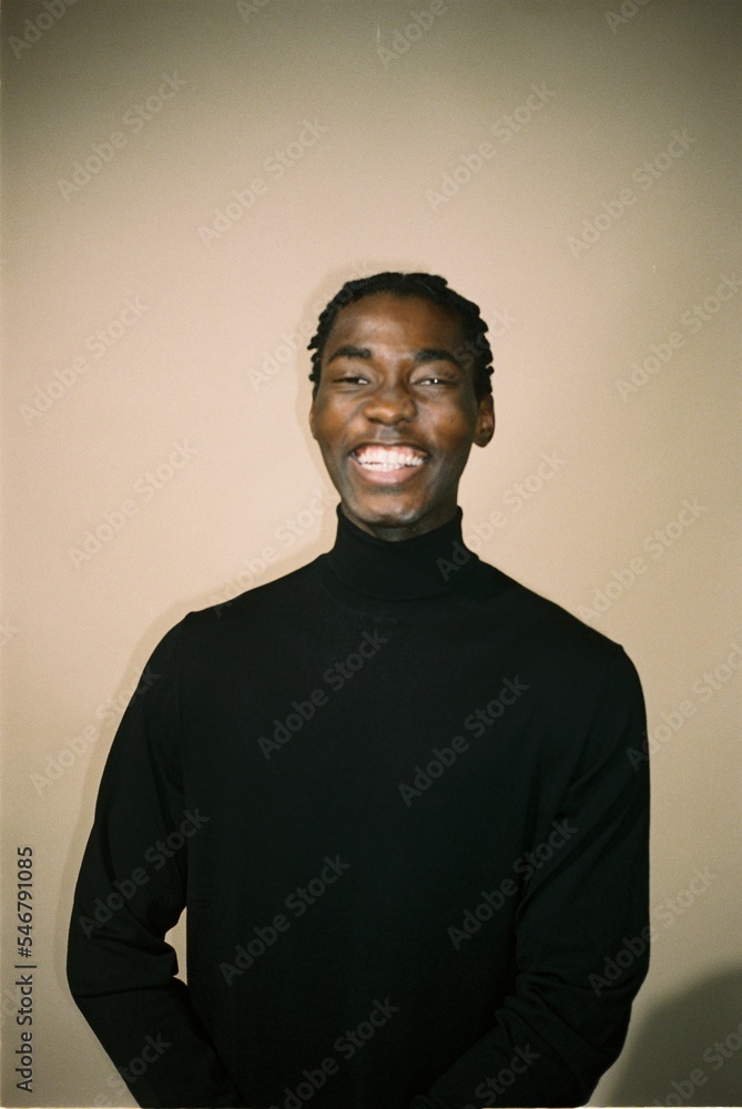 Film photo of a portrait of a laughing black man