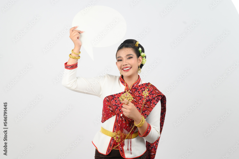 Young beautiful woman in Thai lanna costume with blank speech bubble sign Young beautiful woman in Thai lanna costume with blank speech bubble sign