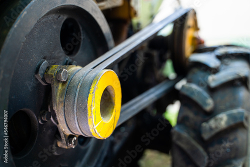Obraz na plátně Walk-behind tractor pulley with two belts close-up