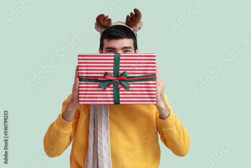 Happy young man in reindeer...