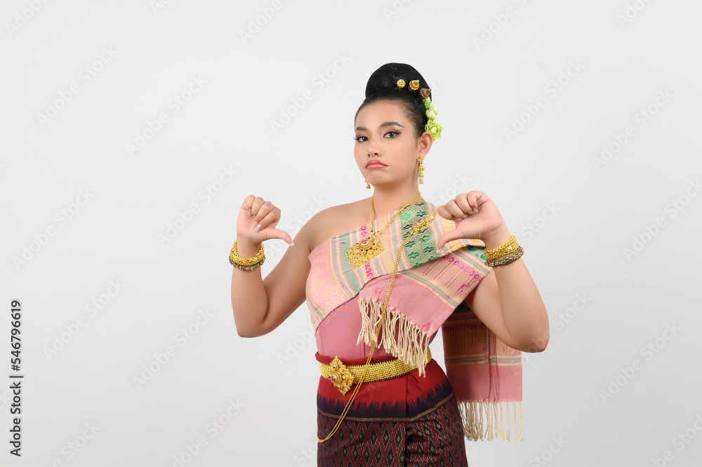 Young beautiful woman in costume of the northeastern region with thumb down posture Young beautiful woman in costume of the northeastern region with thumb down posture
