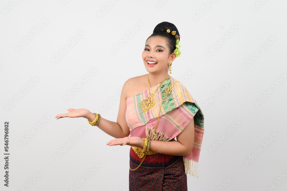 Young beautiful woman in northeastern dress stand and open palm posture Young beautiful woman in northeastern dress stand and open palm posture