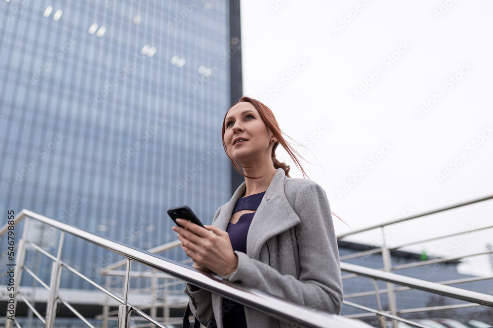 woman accountant with a mobile phone in her hands in the office woman accountant with a mobile phone in her hands in the office