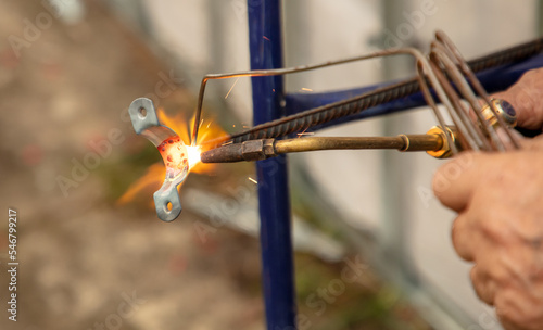 Gas welding of metal at the construction site.